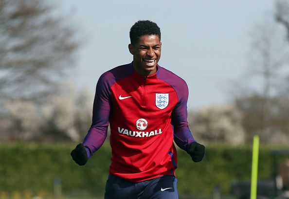 englands-marcus-rashford-shares-a-joke-during-the-training-session-at-picture-id657604094