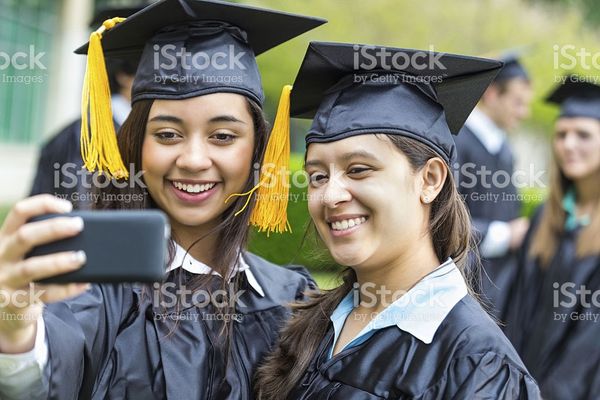 Happy Hispanic Students Taking Selfie At High School Graduation Ceremony stock photo 496993109 | iS…