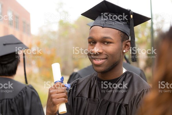 Education Male Graduate And Friends On College Campus stock photo 517934196 | iStock