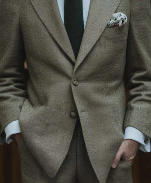 arsenbenda_A_glamour_shot_of_a_tailored_greige_linen_suit_wit_9a9bd9c8-ed3b-4b4a