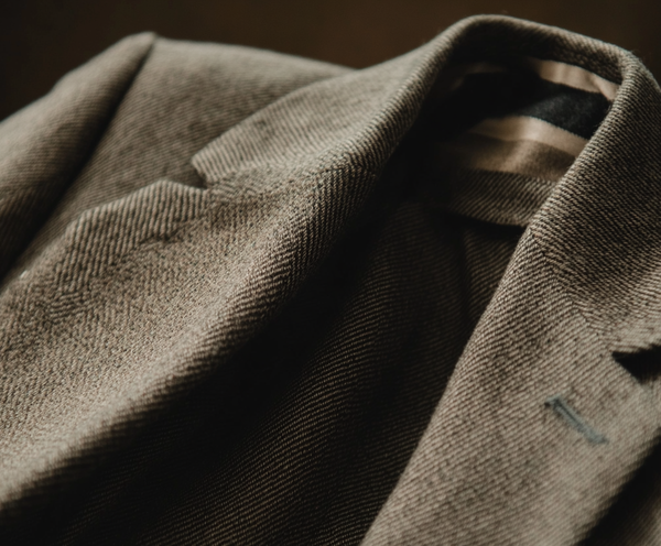 arsenbenda_A_hyper-realistic_close-up_of_a_tailored_wool_suit_9f58faef-a717-4f41