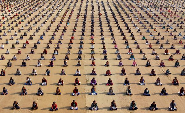 School children attend a yoga session at a camp in Ahmedabad, India, on January 5, 2017.