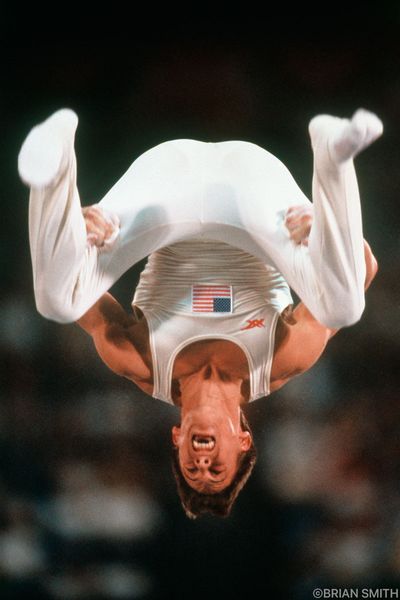 United States Olympic Gymnast Tim Daggett flips during the dismount from the Rings competition at t…