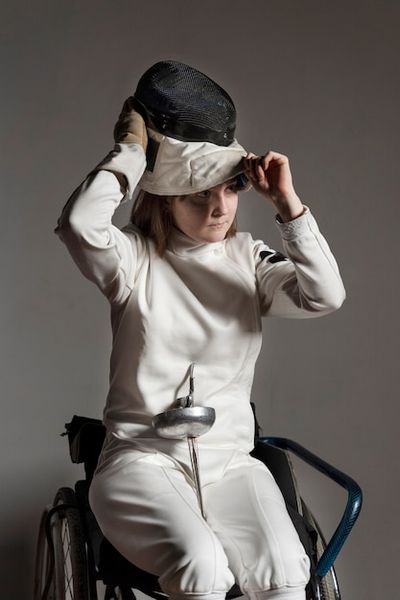 Free Photo | Disabled fencer in special equipment sitting in a wheelchair