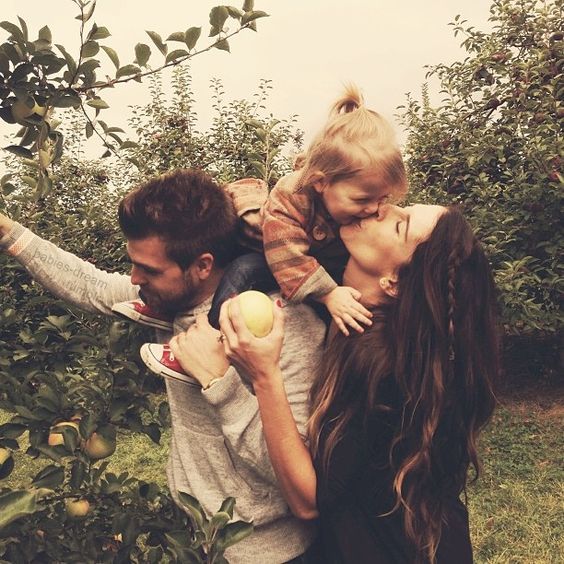 Great idea for a candid family photo shoot. Apple picking or something similar!