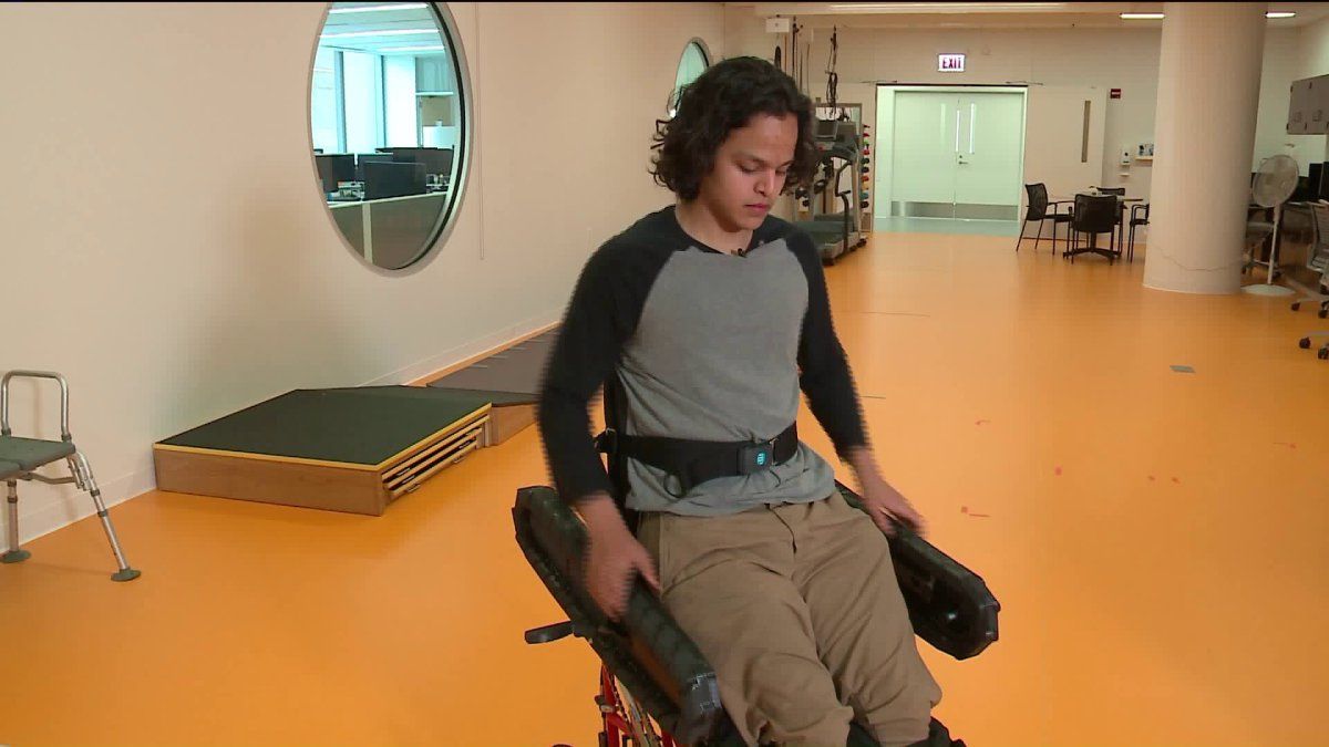 Newly engineered wheelchair rolls, rises and gets everyone on the same level | WGN-TV