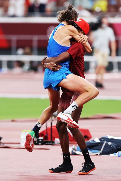 gianmarco-tamberi-of-italy-celebrates-sharing-the-gold-news-photo-1628033037