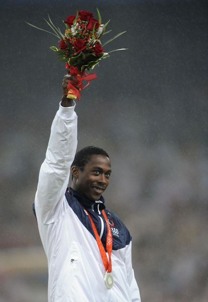 silver-medalist-shawn-crawford-poses-on-the-podium-a-day-news-photo-1619455339
