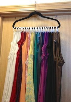 #24. Tank top space saver! Use shower rings in place of more than a dozen hangers. | 29 Sneaky Tips…