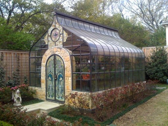 Greenhouse conservatory. Stained glass doors! ....Oh My ! I dream of having one like this on my pro…