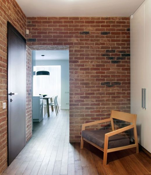 Studio-Apartment-exposed-brick-wall-wooden-floor-designed-by-Lugerin-Architects