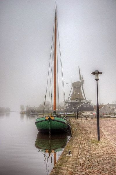 Boat and Windmill on a Misty Day Friesland Netherlands Photography by klaash63