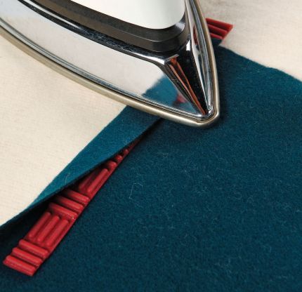 Use slices from a silicone pot holder as guides for pressing.  Great for making hem guides that wil…