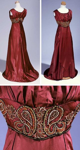 Evening dress, ca. 1909-13. Wine-colored satin trimmed with appliquéd waistband and high lace coll…