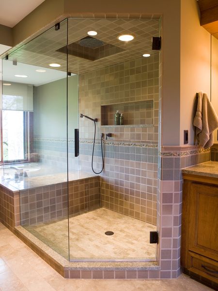 Custom Luxury Shower: Frameless enclosure, bench, built-in niche, 12-inch rain shower head and oil-…