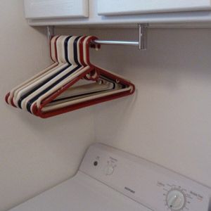 Mount a short towel bar under a cabinet in your laundry room for instant hanger storage.