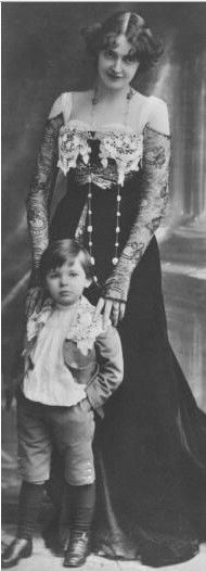 Edwardian Era. Look at that dress~ and the  little boy.  Love his expression!