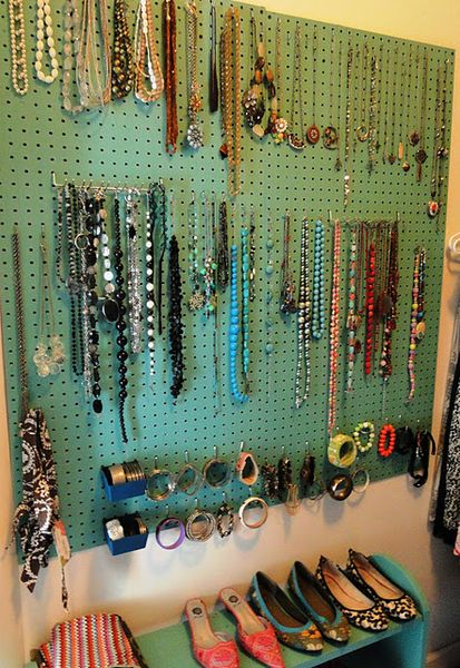Peg board from Lowe's painted a fave color with hooks to hang necklaces and bracelets. Love this