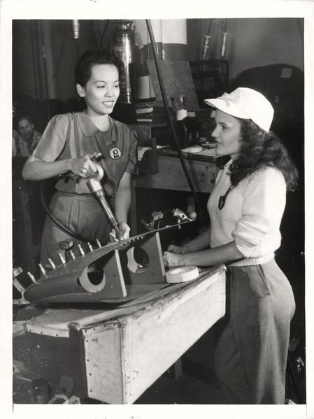 1943- Girls shown working in the airplane wing production line at the Hudson Motor Car Company in D…