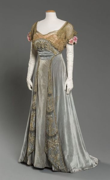 1912 Evening dress of light aqua silk velvet with peach silk satin, metallic lace and beadwork char…