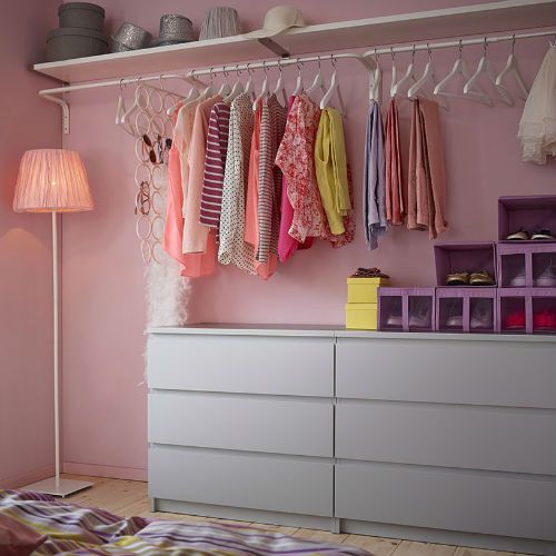 When closet space is limited, make use of the walls with drawers, shelves and clothing bars!