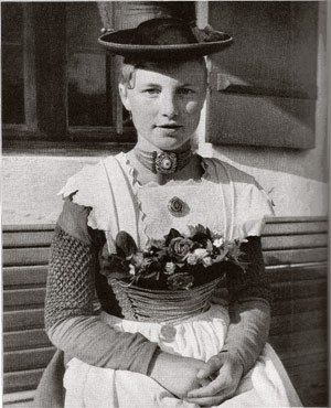 A farmers girl, 1890s wearing a dirndl