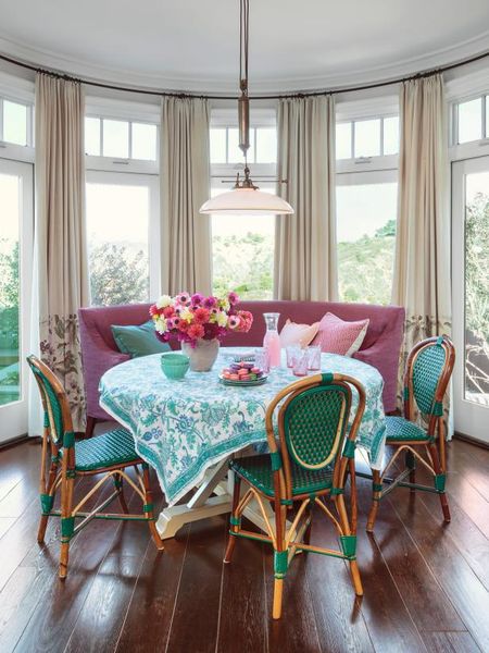 Cafe chairs and a plum bench set the tone for this breakfast area. #color #hgtvmagazine http://www.…