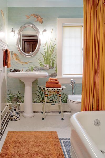 A hand-painted mural of Japanese koi livens up the bathroom in a 1908 Tudor. (Photo: William Wright)