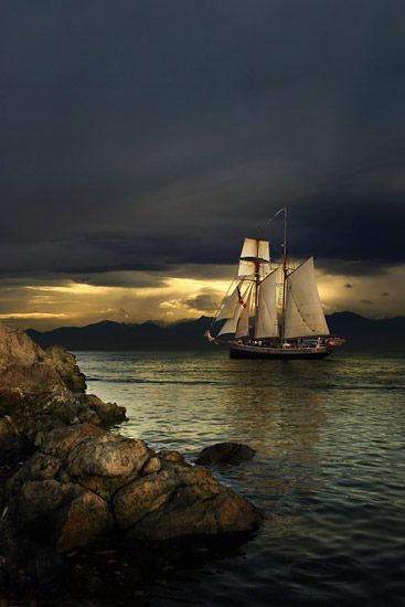 A New Zealand tall ship leaves Victoria Harbour off Vancouver Island heading into the sunset ~ phot…
