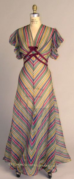 A gauzy, candy striped dress dating from between 1936 and 1938