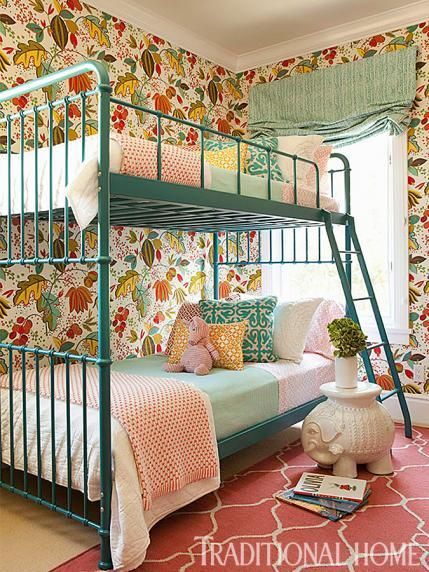 Lively "Regina Fiesta" wallpaper and bunk beds painted a fun turquoise just beg for a slumber party…