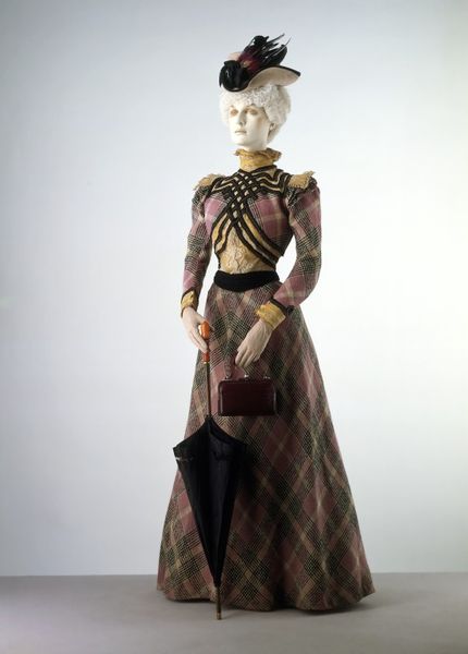 1897 wool dress, trimmed with ribbon, braid and machine-made lace, silk, boned, and lined with cott…