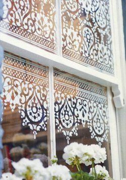 Stencil on windows with acrylic paint for a semi-permanent curtain - just scrape off with a razor b…