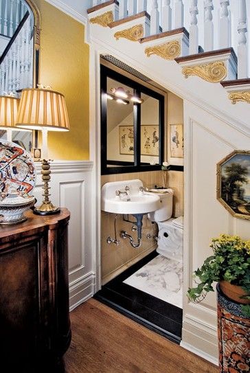 Powder room under stairwell...