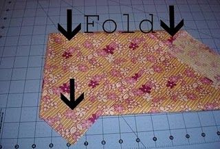 How to fold fabric for cutting bias strips.