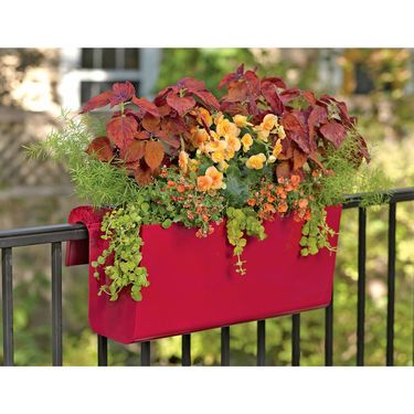 Colorful railing planters make balcony gardens burst.  Self-watering planters are a convenient plac…