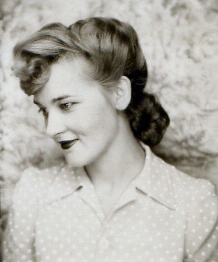 ** Vintage Photo Booth Picture ** Beautiful young woman during the 1940s.