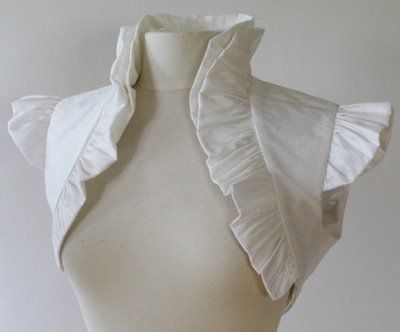 Ruffled white bolero.