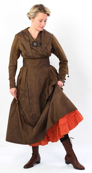 Lucy Adlington models a WW1 brown silk day dress and orange cotton petticoat for History Wardrobe a…