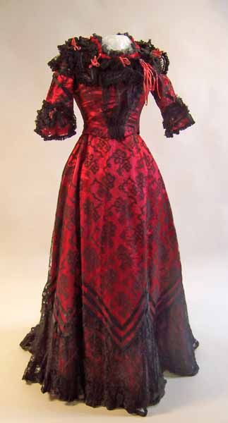 Scarlet satin evening dress with black lace overlay, English, 1899.