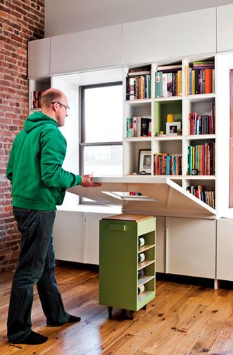 2010, Dwell showcased a wall hiding a bookshelf that folded down to create a table set atop a rolli…