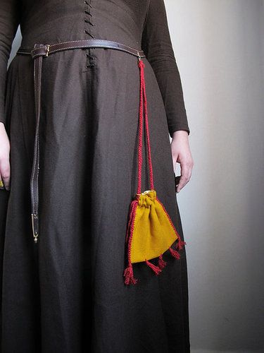 This type of textile bag with tassels can be found in manuscripts and pictures from the middle of t…