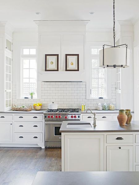Gorgeous, crisp and clean kitchen. I love the detailed molding and the transom windows.