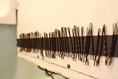 this is a magnet strip in the medicine cabinet for bobby pins to stick on.  blogger says she has ne…