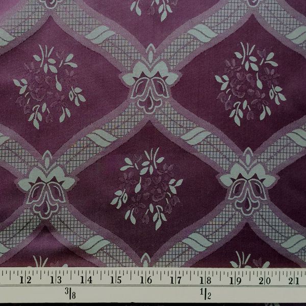 This lovely 100% silk damask in Victorian Plum has a large, stylized diamond pattern with floral mo…