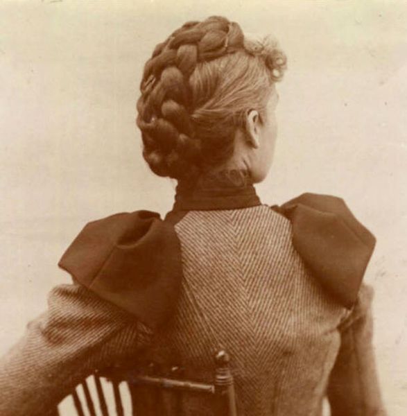 Woman with a braided updo, c. 1890s.