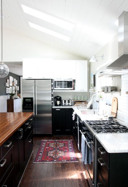 Beautiful black white & butcher block kitchen by @housetweaking