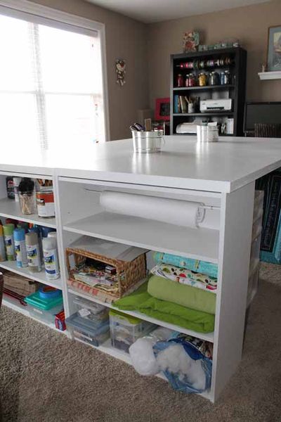 Awesome craft room table. Made of 4 shelving units and 2 hollow doors. Under $100.