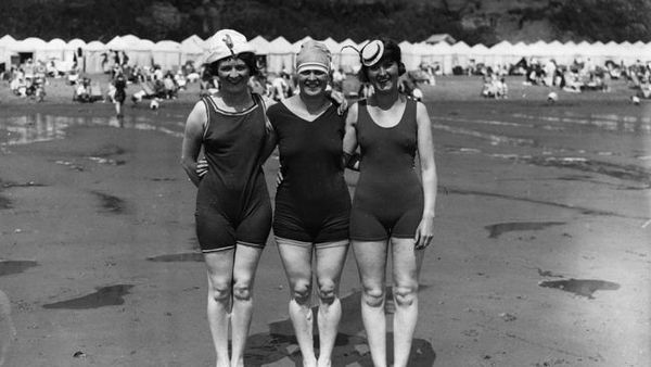 July 1926: Bathers pose on the beach at Shanklin, Isle of Wight. (Central Press/Getty Images)