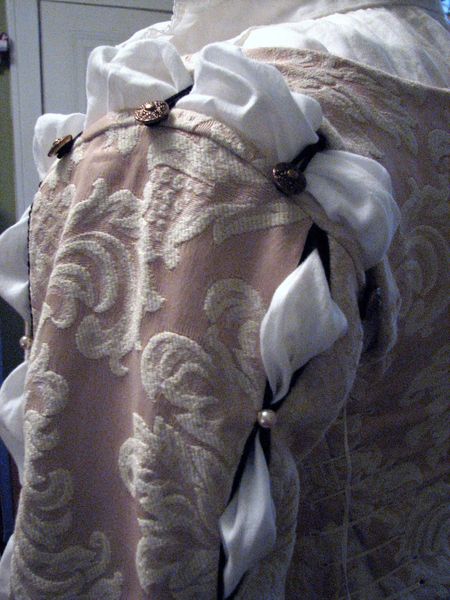 Button and loop sleeve attachment